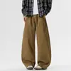 Calça Cargo Casual Nova de Outono com Cordão Solta Estilo Casal Tendência Versátil Perna Larga Calça Foice Sem Sombra Parede