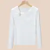 Camiseta de Manga Larga de Diseño Irregular de Gama Alta para Mujer, Primavera 2026 Ajustada Elegante Top Retorcido con Hebilla Metálica