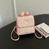 Mochila de Ombro Duplo com Laço de Coração de Amor Fresco Estilo Coreano Feminina 2026 Nova Pequena Mochila Simples para Trabalho e Viagem Kitty