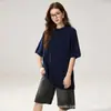 Camiseta de cachemir minimalista y relajada de manga corta para mujer, silueta holgada, cuello redondo, top de punto versátil y favorecedor.