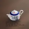 Bule de caligrafia vintage azul e branco pintado à mão, elegante conjunto de chá cultural e criativo para uso doméstico em uma caixa de presente, adequado para negócios corporativos com impressão de logotipo