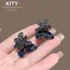 Nuevo y lujoso pasador de pelo de mariposa azul con incrustaciones de diamantes completos, pasador metálico para el flequillo de mujer de alta resistencia con adornos de diamantes, accesorio para el pelo de media coleta