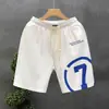 Verano 2023 nuevos shorts blancos estampados marca de moda para hombre pantalones deportivos holgados de cinco puntos pantalones de viaje para hombre Pantalones de playa