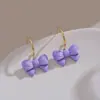 Los nuevos pendientes únicos de este año, diseño especial, pendientes de lazo morado de alta calidad, pendientes pequeños delicados de nicho