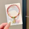 Pulseira de corda colorida zongzi do Festival do Barco-Dragão 2026 novo modelo pulseira trançada artesanal étnica infantil atacado corda vermelha