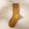 Medias de color liso para hombre, calcetines de otoño e invierno, calcetines cálidos con acolchado de terciopelo, calcetines de rizo apilados, calcetines para mujer, ventas directas de fábrica