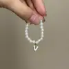 Mini Labubu Cuarta Generación Caja Sorpresa Ropa de Muñeca Collar Colgante Labubu 26 Letras Collar de Perlas Accesorios de Joyería