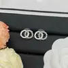 Novedad 2025 Pendientes Chanel Doble C Letra para Mujer, Aguja de Plata Pendientes Trenzados de Lujo de Alta Gama al por Mayor