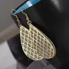 Recolección Transfronteriza de Pendientes Metálicos con Hojas Geométricas Escarchadas, Ganchos para Orejas Creativos Personalizados con Borla de Hoja Redonda Hueca