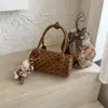 Bolsa cilíndrica de bolinhas estilo coreano transfronteiriça para mulheres, bolsa de mão de nicho doce e legal, bolsa Boston Vintage de ombro e transversal