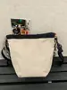 Bolso cruzado distintivo de marca popular, con cordón, versátil, para teléfono móvil, bolso tipo cubo deportivo ligero, bolso de hombro casual