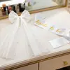 Velo de novia transfronterizo con pasador de lazo de perlas, cinta de malla, banda para el hombro "novia por ser" con relieve dorado, cinturón ceremonial