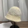 Sombrero de pescador tejido con diseño de patchwork, nuevo estilo coreano otoño/invierno 2026, versátil, favorecedor del rostro, moderno y elegante sombrero de cubo