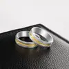 Europa y Estados Unidos joyería de venta caliente habitación oro dos colores anillo de acero inoxidable para mujer 6 mm fresado por lotes cuchillo oblicuo anillo de acero de titanio para hombre