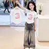 Camiseta de Manga Curta para Meninas Verão 2026 Novo Estilo Tendência Infantil Top Soltinho para Meninas Mais Velhas Top Fino de Meia Manga