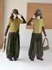 Conjunto de punto de dos piezas falso para niñas, nueva colección primavera/otoño 2026, pantalones de pierna ancha a rayas verdes, atuendo casual de dos piezas para niñas mayores