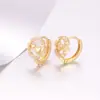 Aretes de aro Xuping con incrustaciones de amor y zirconia artificial, diseño circular hueco, ligeros y versátiles, suministro al por mayor para mujeres