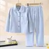 Nuevo conjunto de pijama de manga larga para niños de otoño e invierno 2026, con un conjunto de dos piezas engrosado y forrado de polar con cuello de solapa, adecuado tanto para niños como para niñas