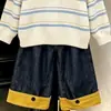Ropa infantil estilo coreano 2026 colección otoño e invierno nueva: suéteres de punto y pantalones de pierna ancha con bloques de color elegantes y modernos para niños y niñas