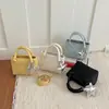 Comercio Exterior Estilo Coreano Lujo Ligero Bolso de Cubo Portátil para Mujer Bolso de Hombro Simple Elegante Nuevo Verano 2026 Bolso Cruzado para el Trabajo