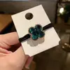 Nova corda de cabelo de celebridade da internet Coreia do Sul Trevo pérola vintage faixa de cabelo Preta corda de cabelo para adulto feminina elástico faixa de cabelo de temperamento
