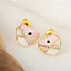 Pendientes de Gota de Aceite con Zirconia Ojos de Amor Chapados en Cobre Oro 18K Distrito Lu Pendientes Avanzados de Nicho Femeninos Explosión Transfronteriza
