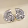 Pendientes de botón geométricos facetados con forma de corazón ovalado transfronterizos europeos y americanos, pendientes de diseño irregular, versátiles, de lujo ligero, tacto de alta gama, adornos para las orejas