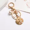Nuevo Estilo Llavero Colgante Inspirado en Chanel Colgante para Funda Protectora de Auriculares Colgante de Corazón de Perla Joyería Colgante para Manija de Puerta