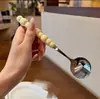 Colher de Aço Inoxidável Pérola de Quatro Cores com Cabo Tipo Cerâmica, Alto Valor Estético, Colher Redonda Resistente a Altas Temperaturas para Uso Doméstico, Atacado