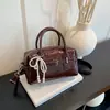 Bolso Boston de alta gama para mujer, nuevo bolso popular de otoño 2026, estilo retro, de un solo hombro, para el trabajo, bandolera