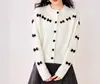 Cardigan de Punto Color Sólido Estilo Coreano con Decoración de Lazo para Mujer 2026 Primavera/Otoño Nuevo Estilo Simple Holgado Versátil Top Moderno