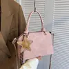Bolso nuevo para mujer 2026 transfronterizo, bolso de mano simple y texturizado para el trabajo, bolso de hombro y cruzado de nicho vintage de alta gama