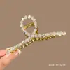2025 Estilo Coreano Aleación Galvanizada Triángulo Geométrico Pinza de Tiburón Accesorio para el Cabello de Mujer Yiwu Fresco y Dulce Accesorio para la Cabeza