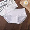 En stock de fábrica ropa interior para niñas sexy de encaje transpirable ropa interior lazo cintura hueca color liso bragas para mujer