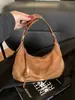 Bolsa Feminina Transfronteiriça Estilo Bolinho Feminina Versátil para o Dia a Dia Bolsa Transversal Bolsa Meia-Lua 2026 Nova Bolsa de Ombro em Camurça Bolsa de Axila