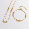 Joyería de Acero de Titanio Dongguan Cadena Redonda de Serpiente Cadena Lisa Cuentas Cruz Simple Pulseras de Tobillo Apilables Europeas y Americanas Juego de Pulsera y Collar para Mujeres