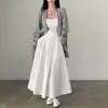 Corea del Sur chic Primavera Estilo francés elegante cintura alta cobertura cruzada adelgazante color liso versátil falda plisada línea A falda larga para mujer