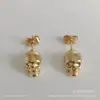 Brincos de tachinha de caveira estilo frio hip hop europeu e americano, brincos personalizados de cabeça de fantasma, brincos retrô para homens e mulheres