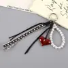Outono e Inverno Retrô Couro Corda Trançada Pingente Decorativo para Bolsa Série Miu Pingente de Celular Coração de Pêssego High-End Corrente Pendente para Mulheres