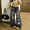 Jeans curvados bordados de dibujos animados Chao Li Youhuo para mujer, nuevo estilo de otoño, pantalones rectos de pierna ancha holgados de cintura alta