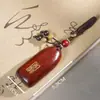 Llave de Ébano, Sándalo Morado, Cuerno de Rinoceronte, Palo de Rosa Incrustado con Paz y Auspiciosidad, Colgante de Madera, Colgante para Teléfono Móvil, Artesanía