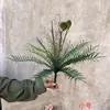 Plantas verdes artificiales en stock, manojos de helecho, hojas de helecho, hierba de helecho para decoración de paredes interiores y diseño de paisajes, césped artificial al por mayor
