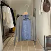 Thirteen Lines Coleção Outono 2026: Camisa de linho elegante, de cor sólida, com design de blusa de tricô falsa de duas peças para mulheres