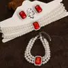 Collar y pulsera de perlas de imitación con flor de diamante francés, cadena de clavícula de nicho de moda, joyería de alta gama que combina con todo.