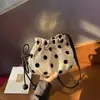 Bolso cubo de cordón de lunares de nicho estilo coreano para mujer, nuevo y súper popular de moda 2026, bolso de hombro y cruzado