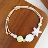 Jingdezhen Navidad Pulsera de Cuerda Trenzada de Cerámica Pulsera de Trébol de Cuatro Hojas Joyería Artística Hecha a Mano Venta al por Mayor Pulseras de Cerámica para Atracciones Turísticas