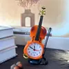 Reloj despertador de simulación de violín al por mayor directo de fábrica, reloj de escritorio creativo con forma de instrumento musical, decoración de sala de estar, reloj de mesa