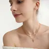 Collar para mujer estilo europeo y americano Wanxing, acero inoxidable bañado en oro de 18k, colgante de cruz con circonita, juego de collares, venta al por mayor transfronteriza, en stock