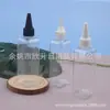 Botella cuadrada transparente de 100 ml con pico puntiagudo, botella para aceites esenciales, dispensador de aceite, botella dispensadora de agua y loción, y botella llena de agua con pico puntiagudo