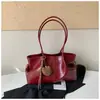 Bolsa tote de color sólido, estilo retro, gran capacidad, nueva colección 2026, moderna, simple y elegante, adecuada para el trabajo y los desplazamientos, bolso de hombro